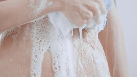 person showering close up