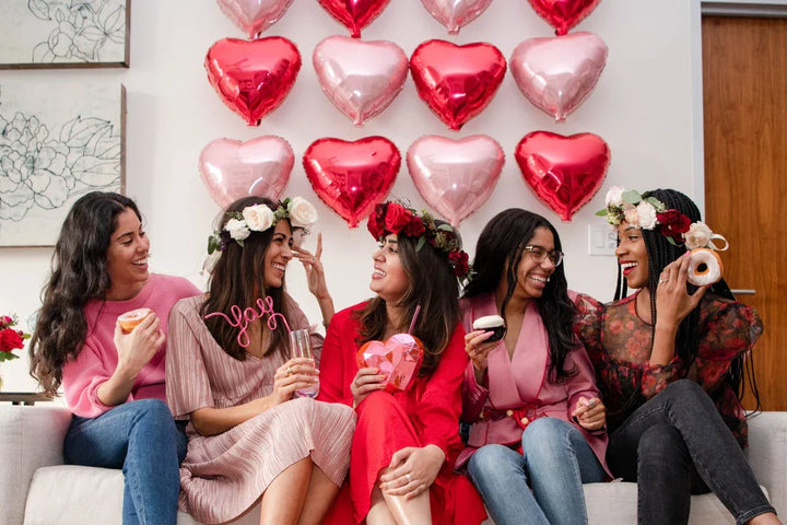 galentines party with cute heart decor and cupcakes