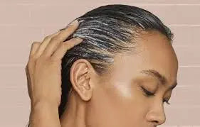 lady applying hair treatment