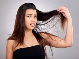 lady with brown hair looking disgusted and confused