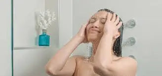 lady washing hair in shower