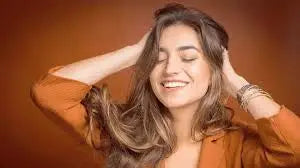 lady smiling scrunching her hair