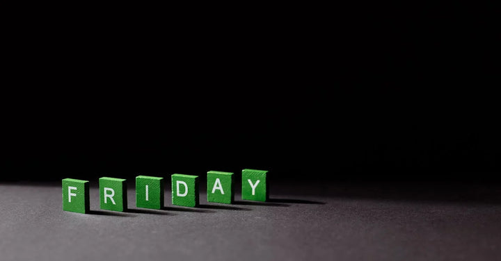 green letter blocks lined up to spell "friday"