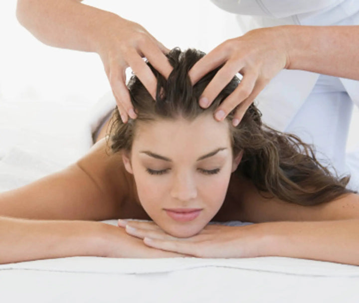 lady getting a scalp massage, front view