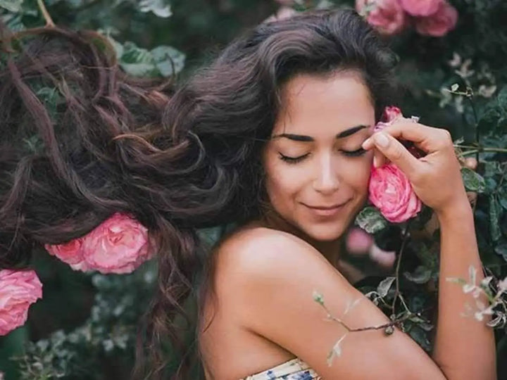 lady with flowers, in a bush, close up portrait